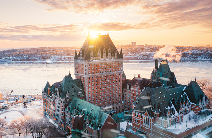 Drone shot of Fairmont Le Château Frontenac in a snowy landscape