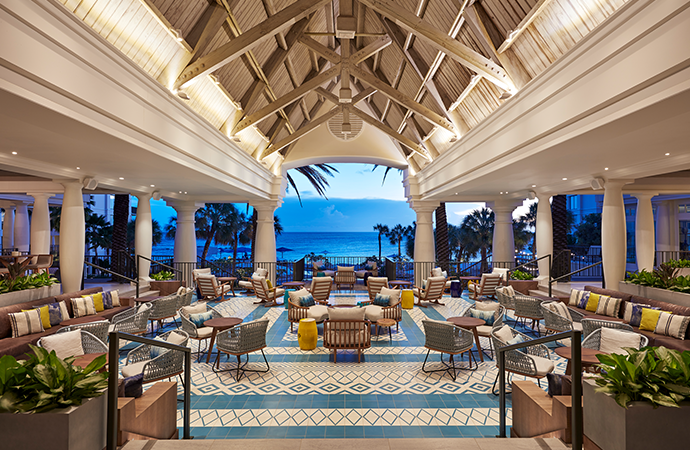 Inside the Curaçao Marriott Beach Resort Greatroom looking out onto the sea at dusk